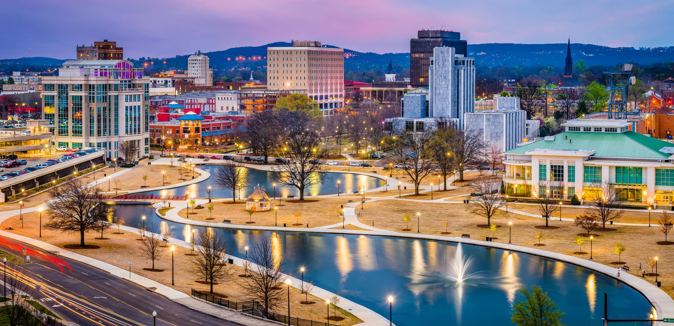 Downtown Huntsville, Alabama at dusk, with Big Spring Park and the Von Braun Center